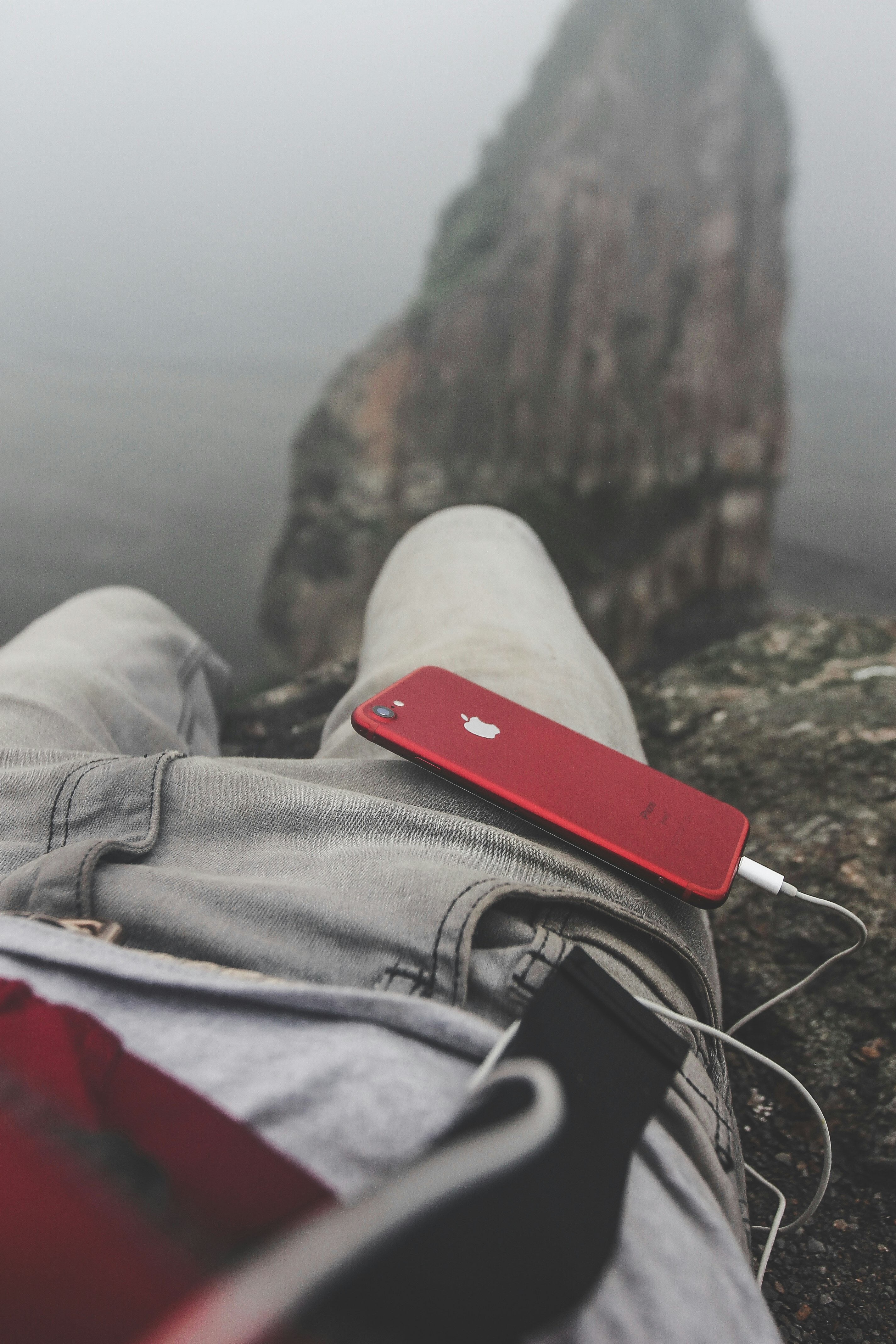 PRODUCT RED iPhone on person's lap